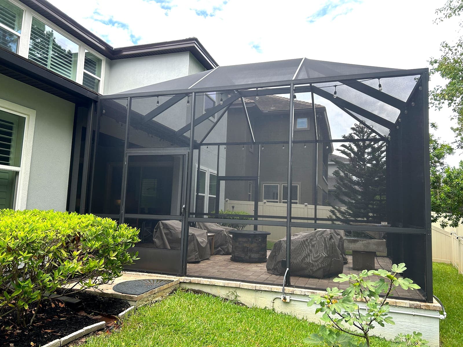 The same pool enclosure cleaned, the mesh clear and the frame even.