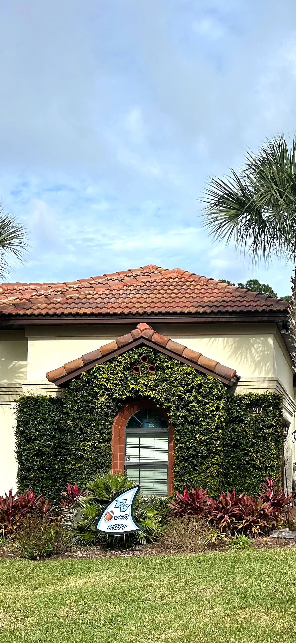 The same barrel tile roof after soft washing, the terracotta even across every tile.